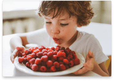 boy-eating-raspberries